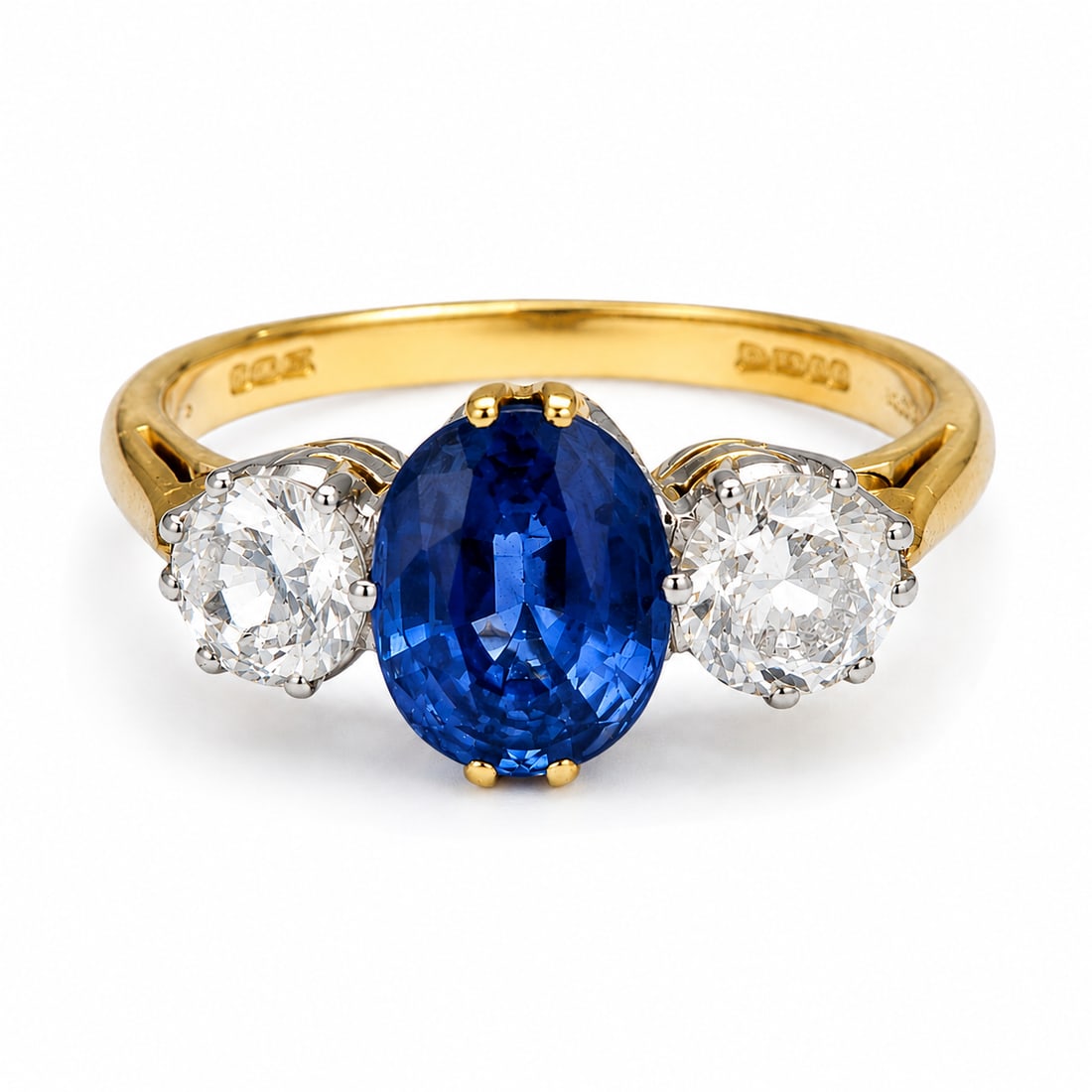 SAPPHIRE AND DIAMOND 3-STONE RING: SAPPHIRE AND DIAMOND 3-STONE RING,4.9 grams, 18 ct. gold.Sapphire of approx. 2 ct.Diamonds totalling approx. 0.90 ct.Size O 1/2.