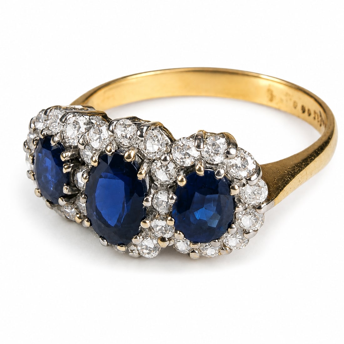 SAPPHIRE AND DIAMOND TRIPLE CLUSTER RING: SAPPHIRE AND DIAMOND TRIPLE CLUSTER RING,3.6 grams, testing 18 ct. gold.Rich and vibrant sapphires, totalling approx. 1.20 ct.Diamonds bright and lively.Size P 1/2.