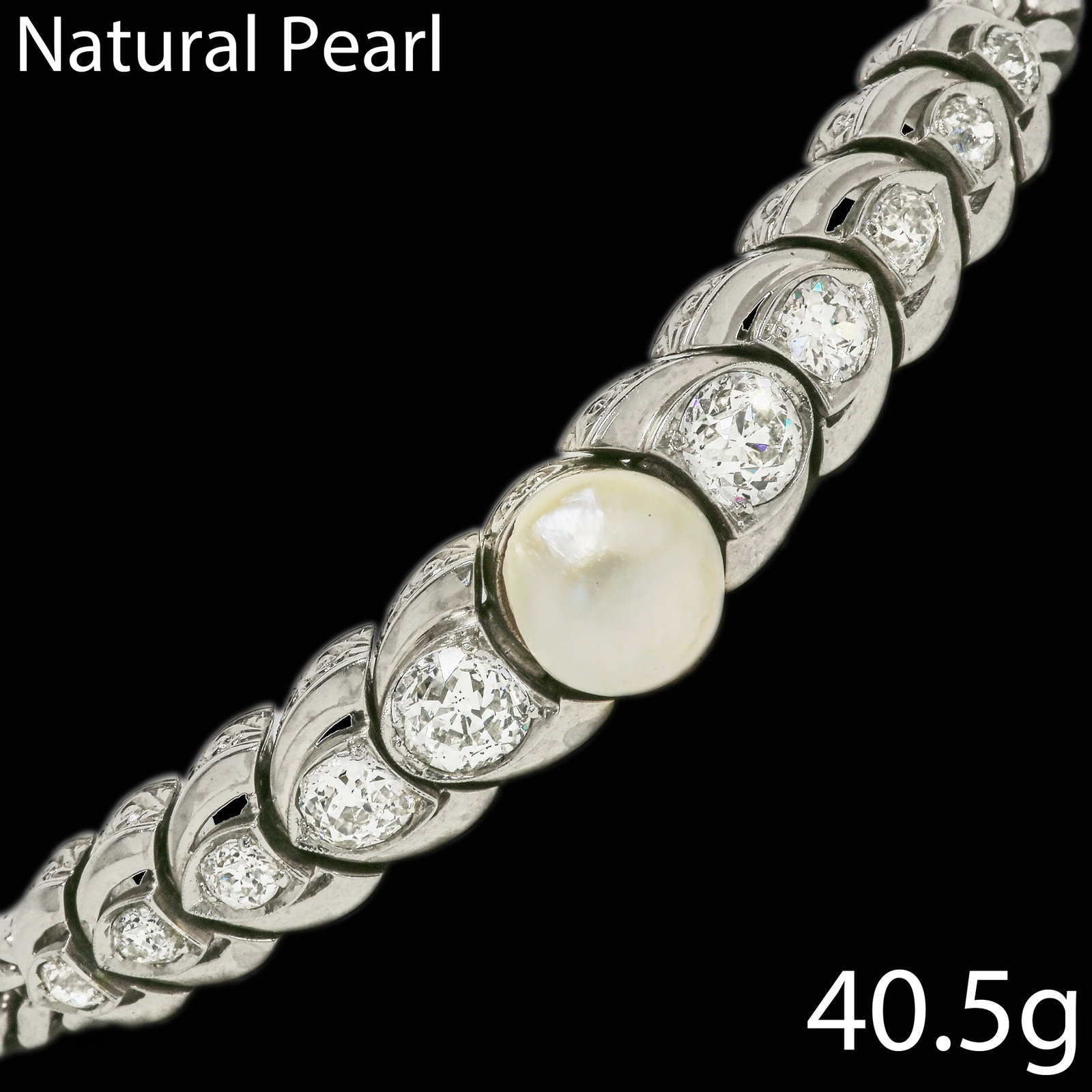 FINE NATURAL PEARL AND DIAMOND BRACELET: FINE NATURAL PEARL AND DIAMOND BRACELET40.5 grams. 14 ct. gold.fine natural freshwater pearl (Verbal). bright lively old cut diamondsapprox. 3.50 ct. in great condition L 19 cm
