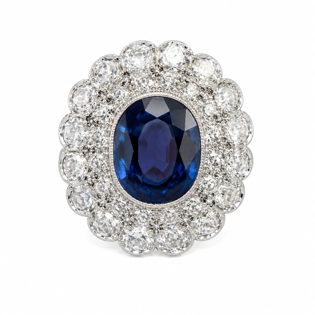 SAPPHIRE AND DIAMOND CLUSTER RING: SAPPHIRE AND DIAMOND CLUSTER RING,4.7 grams, testing platinum.Rich and vibrant sapphire of approx. 4.25 ct.Diamonds in a double halo, bright and lively, totalling approx. 2.20 ct.Size N 1/2.
