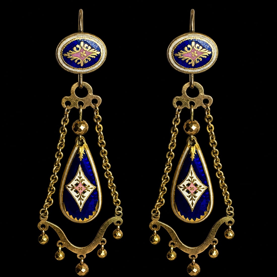 PAIR OF ANTIQUE ENAMEL DROP EARRINGS: PAIR OF ANTIQUE ENAMEL DROP EARRINGS,5.9 grams, testing high carat gold.Lovely multi colour enamel.Fine articulated drops.L. 6.3 cm.