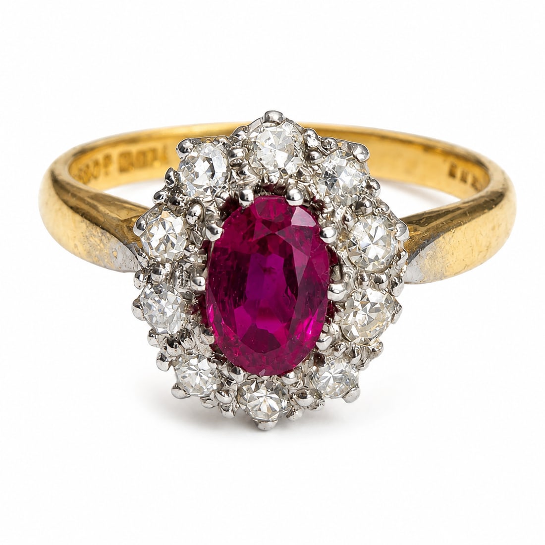 RUBY AND DIAMOND CLUSTER RING: RUBY AND DIAMOND CLUSTER RING,3,3 grams, 18 ct. gold.Rich and vibrant ruby.Diamonds bright and lively.Size M.