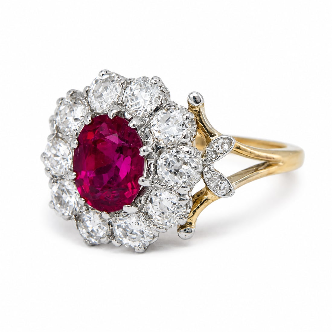 RUBY AND DIAMOND CLUSTER RING: RUBY AND DIAMOND CLUSTER RING,3,2 grams, testing 18 ct. gold.Rich and vibrant ruby.Diamonds bright and lively.Size J 1/2.