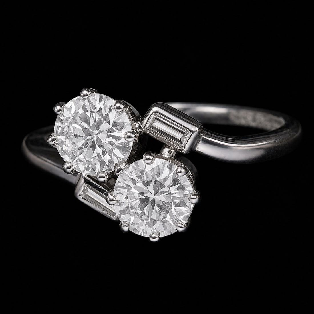 DIAMOND TOI-ET-MOI TWIST RING: DIAMOND TOI-ET-MOI TWIST RING,3.7 grams, testing platinum.Bright and lively diamonds, totalling approx. 0.80 ct.Size N.