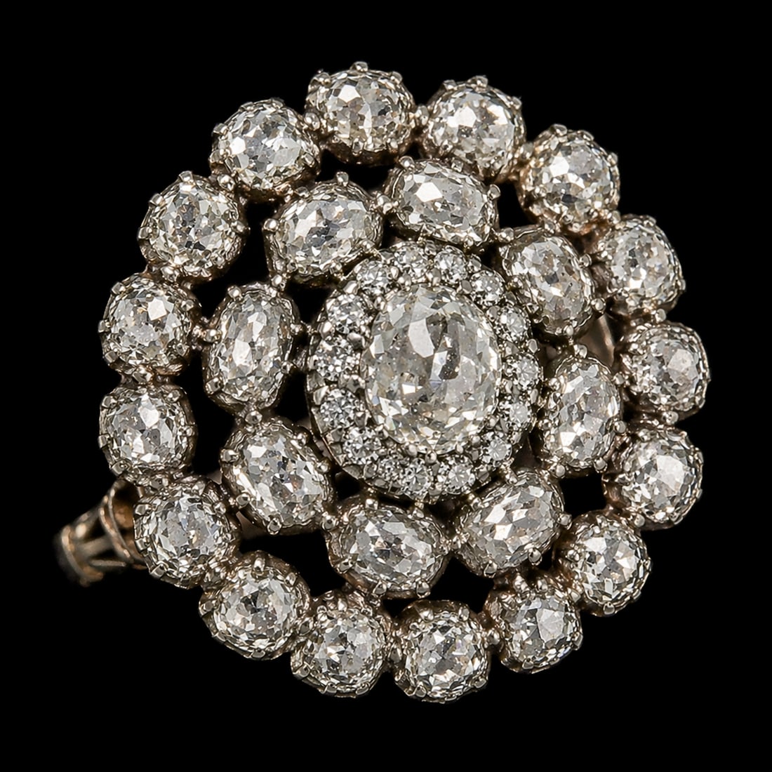 GEORGIAN DIAMOND CLUSTER RING: GEORGIAN DIAMOND CLUSTER RING,3.9 grams, testing high carat gold and silver.Bright and lively old cut diamonds, totalling approx. 2 ct.Size M.