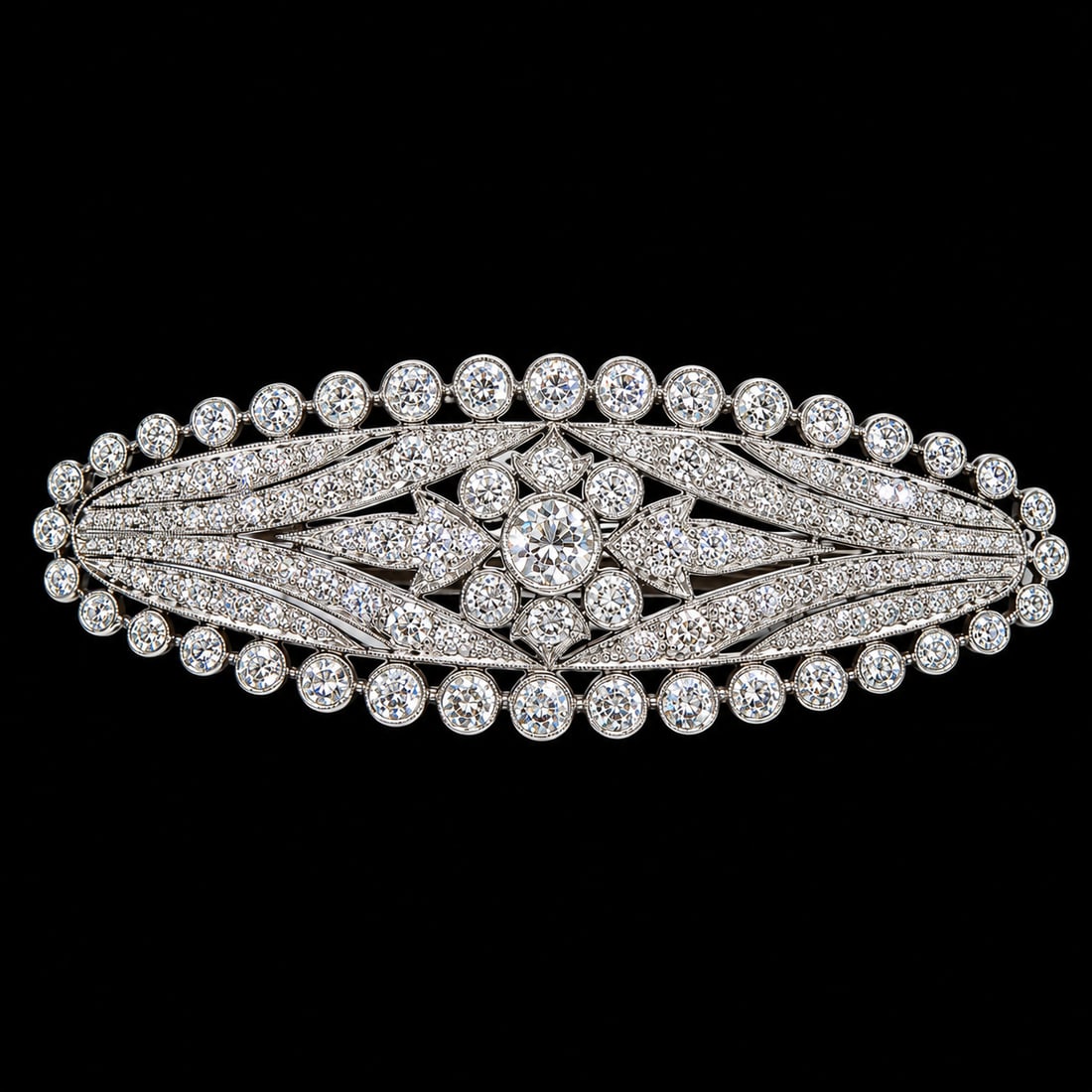 LARGE DIAMOND BROOCH: LARGE DIAMOND BROOCH,11,6 grams, testing platinum.Bright and lively diamonds, totalling approx. 4 ct.W. 6 cm.