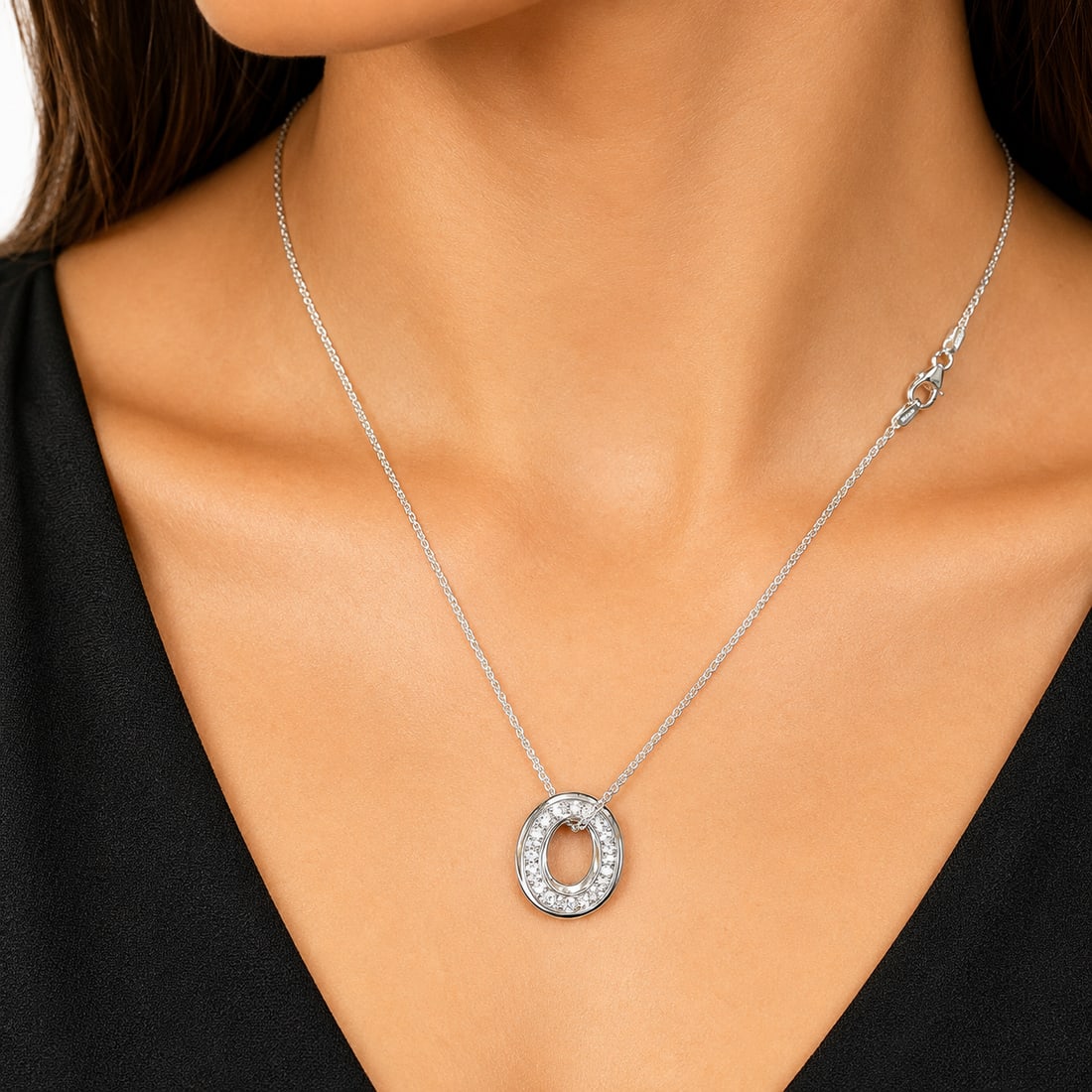 LOVELY DOUBLE SIDED DIAMOND PENDANT WITH NECKLACE: LOVELY DOUBLE SIDED DIAMOND PENDANT WITH NECKLACE,14.6 grams, testing 18 ct. gold.Bright and lively diamonds, front and back of the pendant, totalling approx. 1.50 ct.L. pendant. 2.1 cm.L. necklace 40