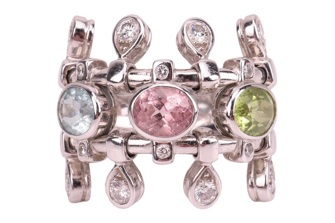 DIOR DEUX EPICES MULTI GEMSTONE AND DIAMOND RING: DIOR DEUX EPICES MULTI GEMSTONE AND DIAMOND RING,13.6 grams, 18 ct. gold.Set with a tourmaline, peridot and aquamarine.Accentuated with articulted diamonds.Signed Dior and numbered.Size L 1/2.