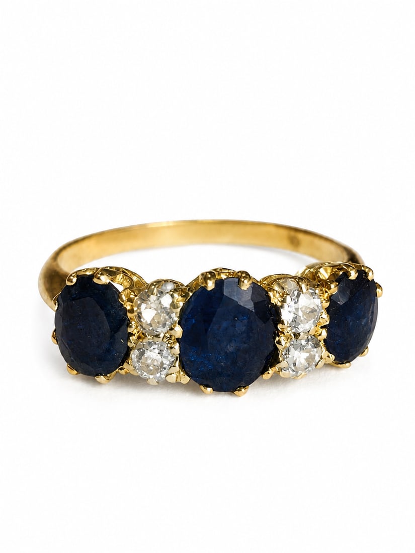 SAPPHIRE AND DIAMOND RING: SAPPHIRE AND DIAMOND RING,3,3 grams, testing 18 ct. gold.Rich and vibrant sapphires, totalling approx. 2.15 ct.Diamonds bright and lively.Size P.
