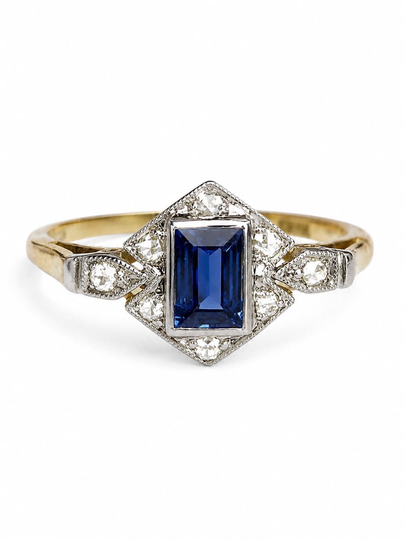 SAPPHIRE AND DIAMOND CLUSTER RING: SAPPHIRE AND DIAMOND CLUSTER RING,testing 18 ct. gold and platinum.Rich and vibrant sapphire.Diamonds bright and lively.Size O 1/2.