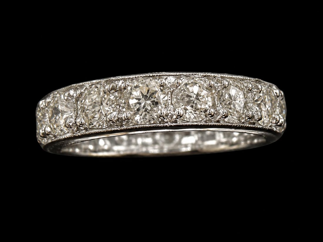 DIAMOND FULL ETERNITY RING: DIAMOND FULL ETERNITY RING,9.3 grams, platinum.Bright and lively diamonds, totalling approx. 3.20 ct.Size L 1/2.
