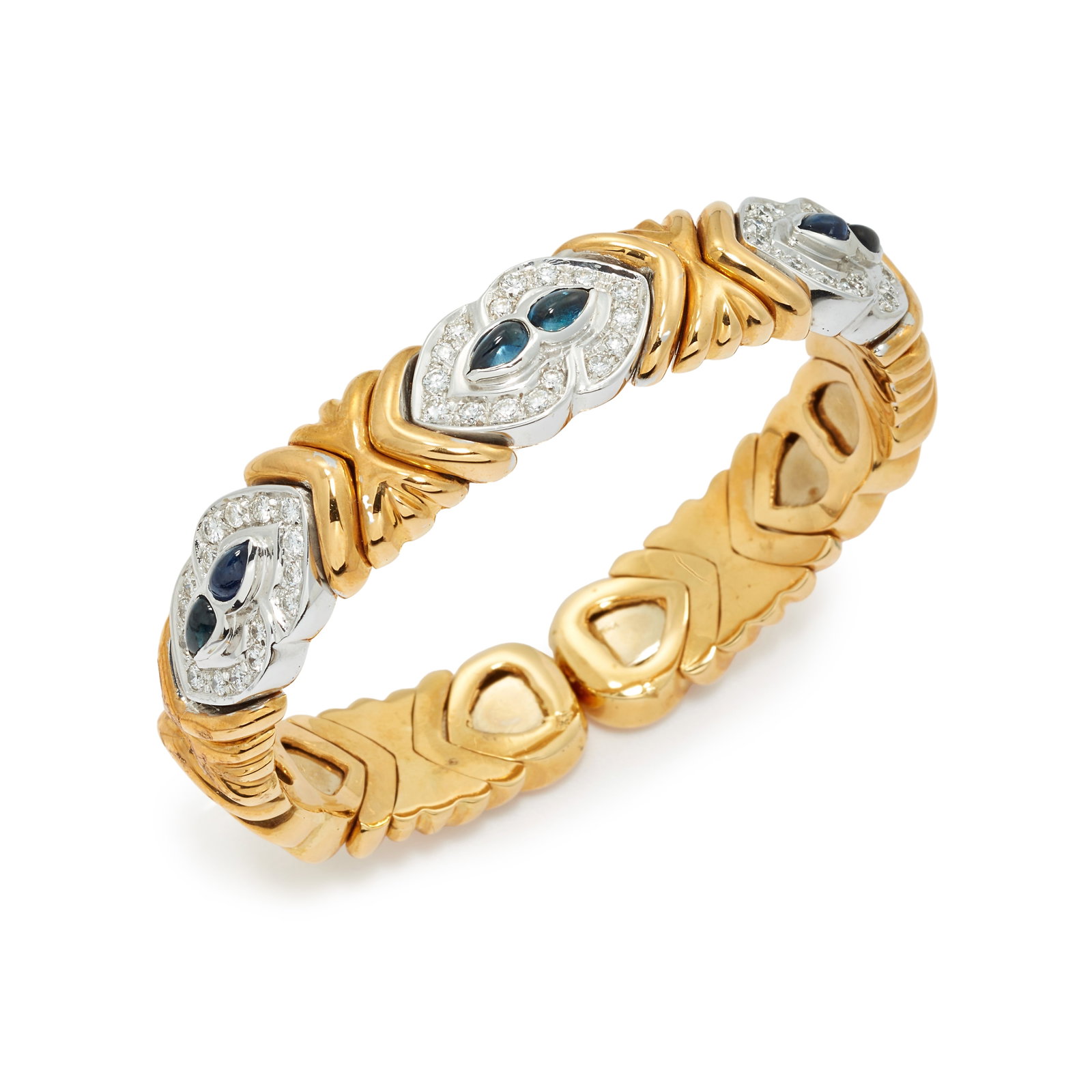 FINE SAPPHIRE AND DIAMOND SPRING BANGLE: FINE SAPPHIRE AND DIAMOND SPRING BANGLE,55,6 grams, testing 18 ct. gold.Bright and lively diamonds, totalling approx. 2.40 ct.Lovely cabochon cut sapphires.Inner diam. 4.9 cm.In the style of Bulgari.