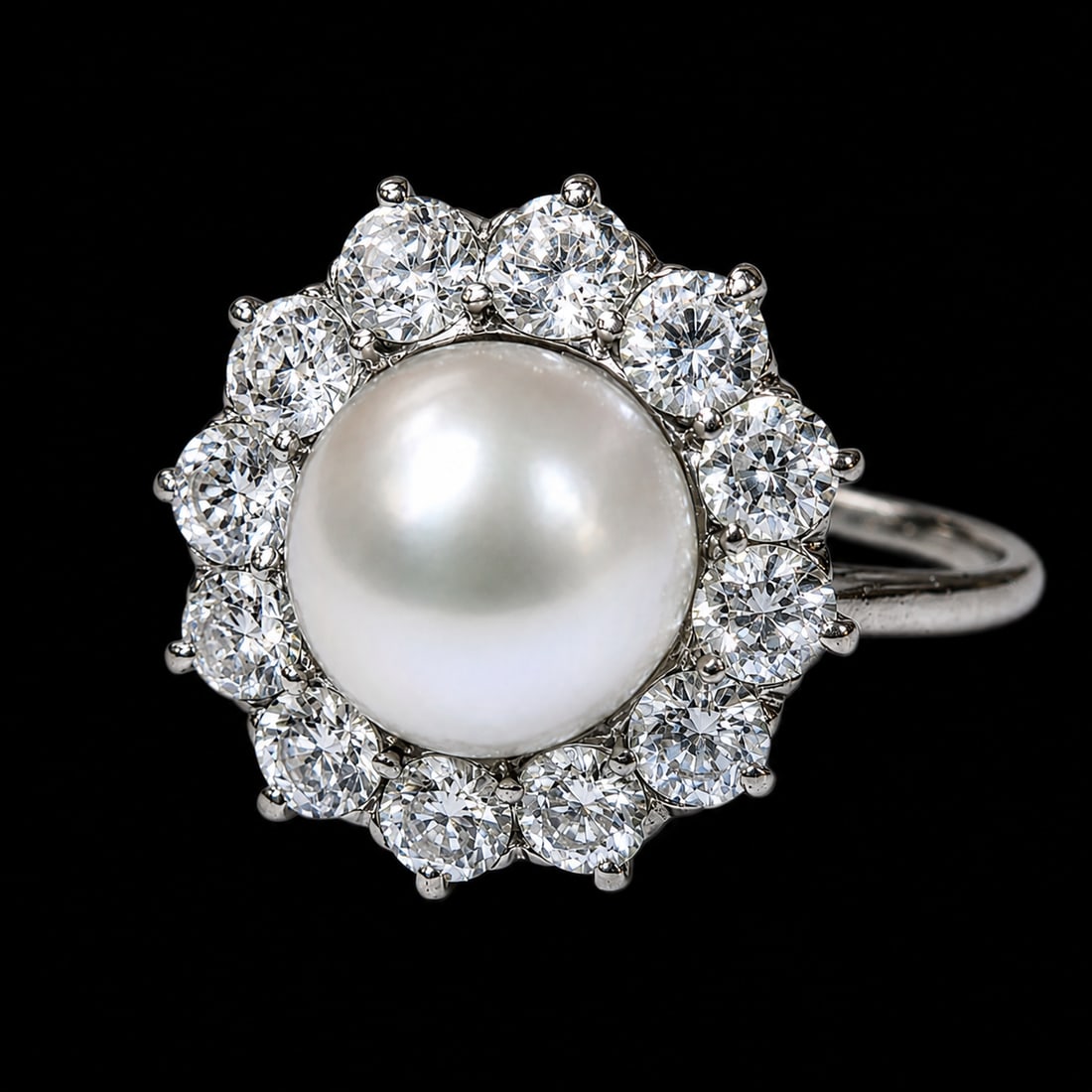 CERTIFICATED NATURAL PEARL AND DIAMOND CLUSTER RING: CERTIFICATED NATURAL PEARL AND DIAMOND CLUSTER RING,3 grams, testing platinum.Fine pearl of approx. 8.24 x 7.75 x 7.23 mm. (Certificated, Natural Saltwater).Bright and lively old cut diamonds.Size N 1