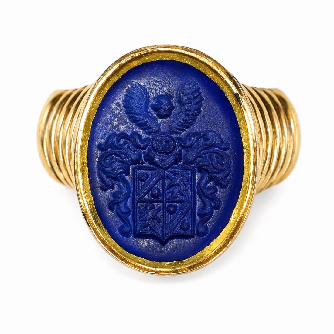 LARGE LAPIS LAZULI INTALGIO SEAL RING: LARGE LAPIS LAZULI INTALGIO SEAL RING,10.7 grams, testing high carat goldThe lapis lazuli fine carved with a heraldic family crest.Size P 1/2.
