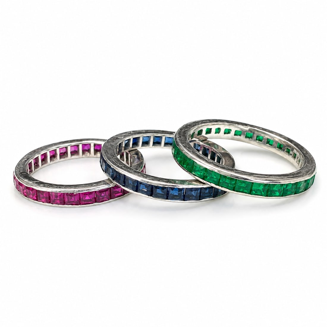 EMERALD, SAPPHIRE AND RUBY ETERNITY RINGS: EMERALD, SAPPHIRE AND RUBY ETERNITY RINGS 6.6 grams high carat gold rich vibrant gem stones in great condition size J