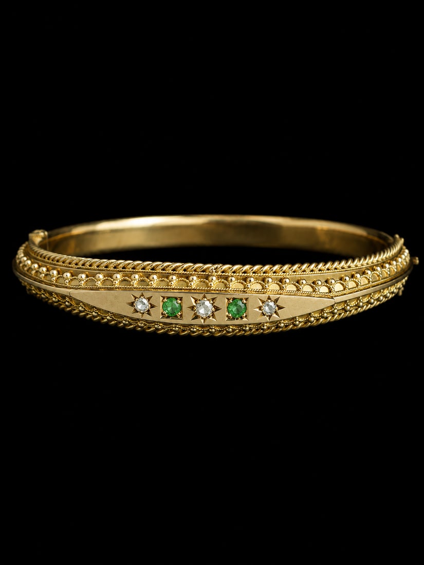 EDWARDIAN DEMANTOID GARNET AND DIAMOND HINGED GOLD BANGLE: EDWARDIAN DEMANTOID GARNET AND DIAMOND HINGED GOLD BANGLE,9.4 grams. Vibrant demantoid garnets.Diamonds bright and lively.Inner diam. 5.9 cm.