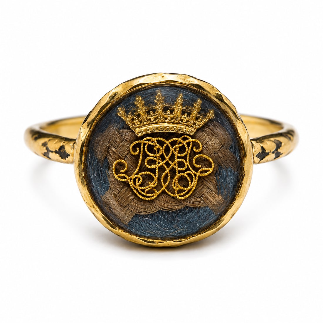 STUART CRYSTAL AND ENAMEL RING: STUART CRYSTAL AND ENAMEL RING,4.4 grams, testing 18 ct. gold.Fine wirework monogram design topped with a crown. The back of the head and shoulders with enamel.Size N 1/2.
