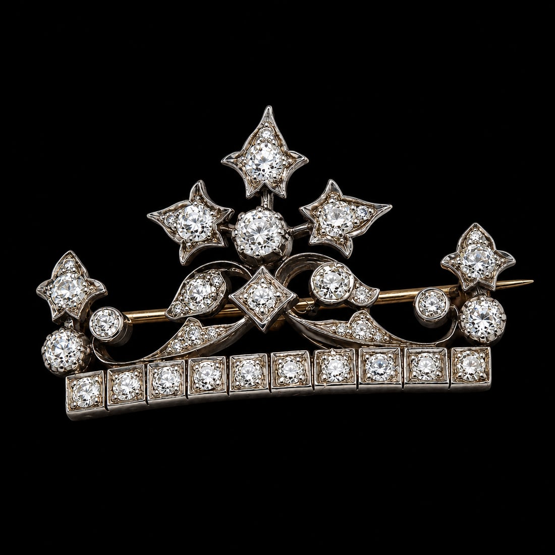 VICTORIAN DIAMOND CROWN BROOCH: VICTORIAN DIAMOND CROWN BROOCH,8.7 grams, testing high carat gold and silver.Bright and lively old cut diamonds.W. 4.1 cm.