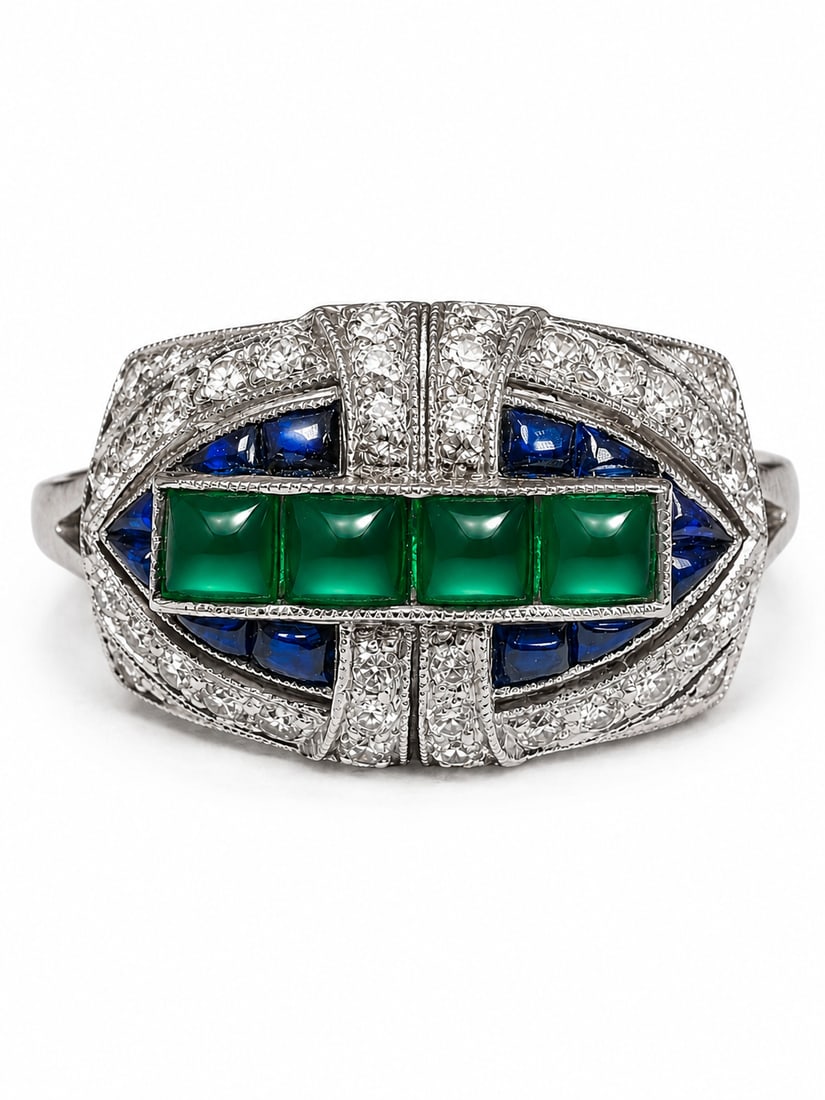 FINE ART-DECO EMERALD SAPPHIRE AND DIAMOND RING: FINE ART-DECO EMERALD SAPPHIRE AND DIAMOND RING,5,7 grams, testing 18 ct. gold.Lovely sugarloaf cut emeralds.Vibrant sapphires.Diamonds bright and lively.Size O.