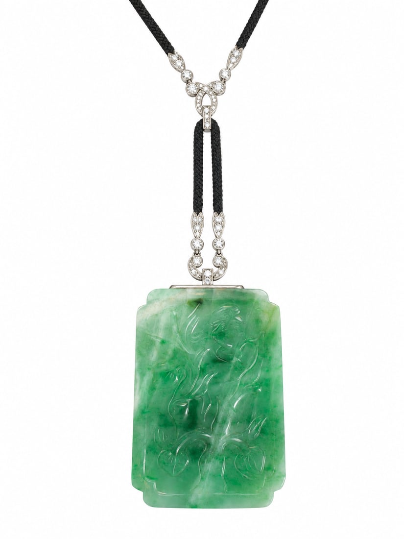 ART-DECO JADE AND DIAMOND PENDANT NECKLACE: ART-DECO JADE AND DIAMOND PENDANT NECKLACE,30.5 grams, testing platinum.Lovely carved jade plaque of approx. 5 x 3.4 cm.Diamonds bright and lively.L necklace 72 cm.