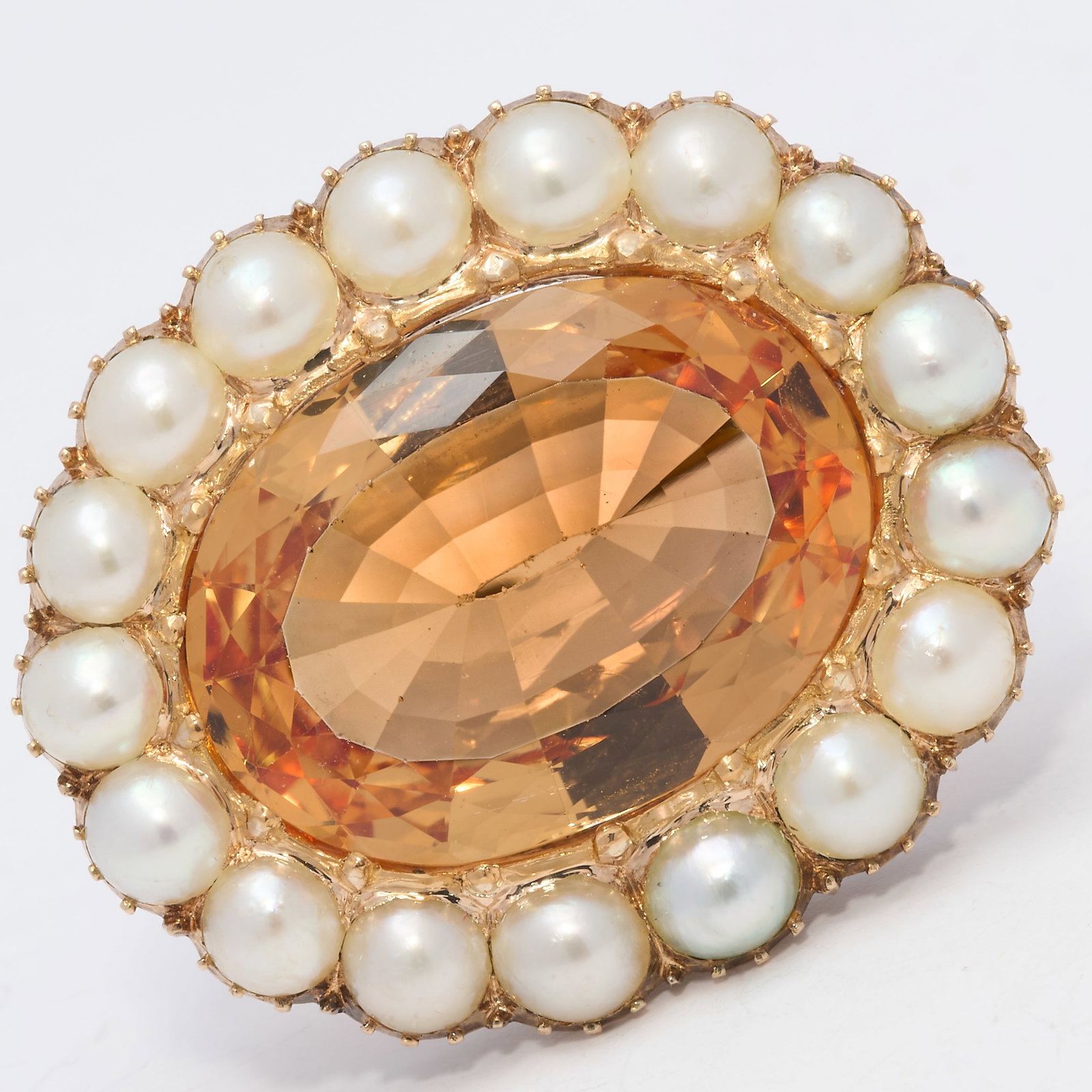 FANTASTIC CERTIFICATED IMPERIAL TOPAZ AND PEARL BROOCH: FANTASTIC CERTIFICATED IMPERIAL TOPAZ AND PEARL BROOCH,14,5 grams, testing high carat gold.Rich and vibrant imperial topaz of approx. 17.61 ct. (Certificated, Imperial Topaz).Strong colour and great