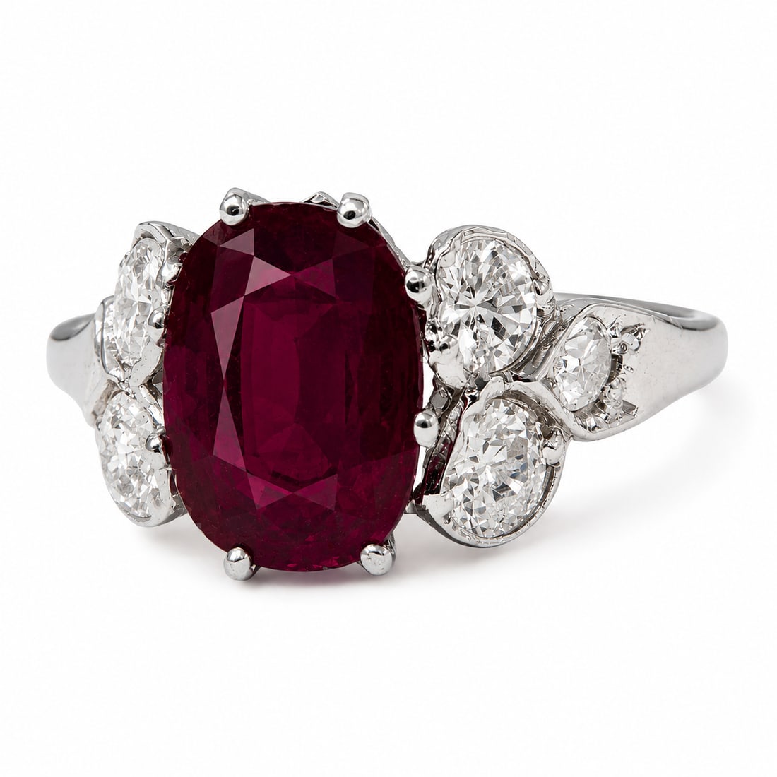 RUBY AND DIAMOND RING: RUBY AND DIAMOND RING,testing 18 ct. gold.Rich and vibrant ruby of approx. 1.25 ct.Diamonds bright and lively.Size J.