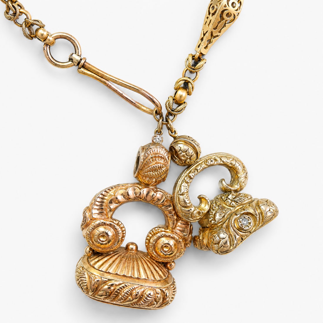 ANTIQUE FANCY LINK NECKLACE WITH 2 FOB SEALS,: ANTIQUE FANCY LINK NECKLACE WITH 2 FOB SEALS,39.3 grams. Necklace testing 15 ct. gold, large seal testing 18 ct. goldThe fancy link necklace with alternated rigid and flexible sections.Supporting 2 fo