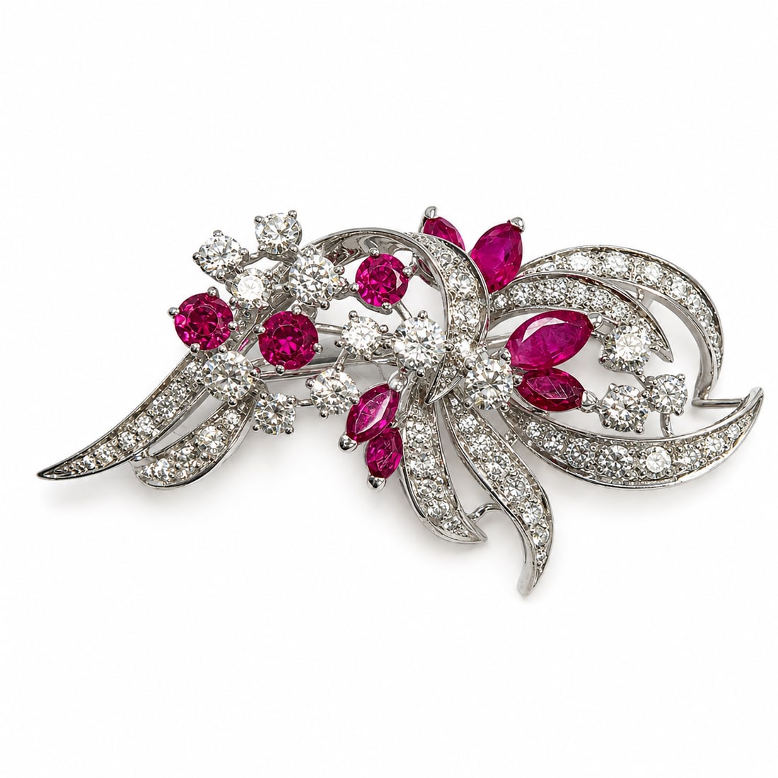 FINE RUBY AND DIAMOND BROOCH: FINE RUBY AND DIAMOND BROOCH,10.5 grams, testing high carat gold.Rich and vibrant rubies.Diamonds bright and lively, totalling approx. 2.20 ct.L. 5 cm.