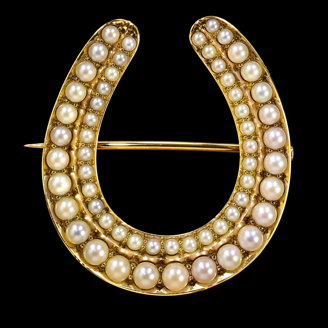 VICTORIAN DOUBLE ROW HORSESHOE PEARL BROOCH: VICTORIAN DOUBLE ROW HORSESHOE PEARL BROOCH,5 grams, testing high carat gold.Pearls generally well matched.L. 2.4 cm.