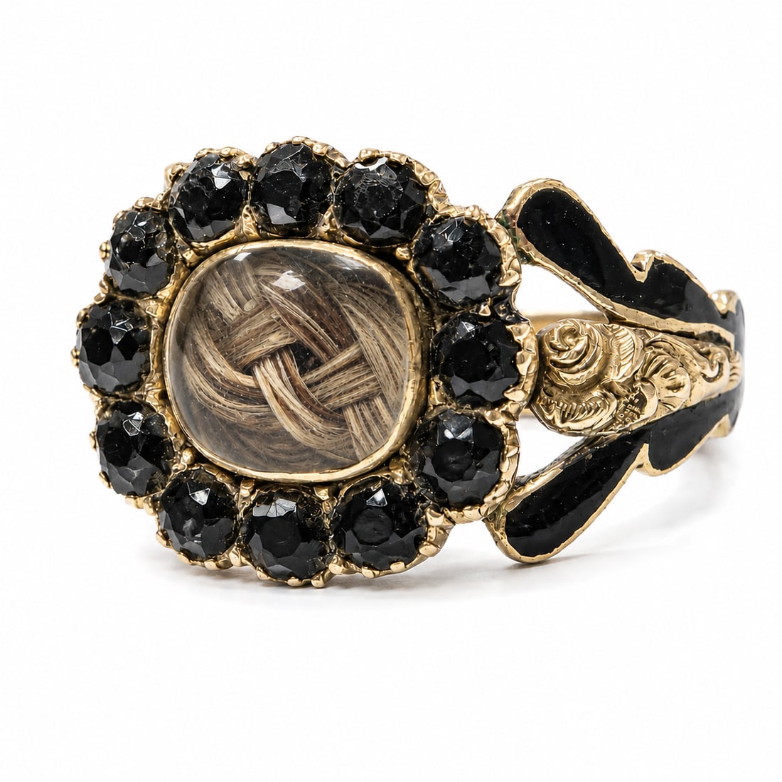 GEORGIAN ENAMEL AND JET RING: GEORGIAN ENAMEL AND JET RING,3,7 grams, 18 ct. gold.The centre with a locket surrounded by jet.Part black enamel on the shoulders.Size N.