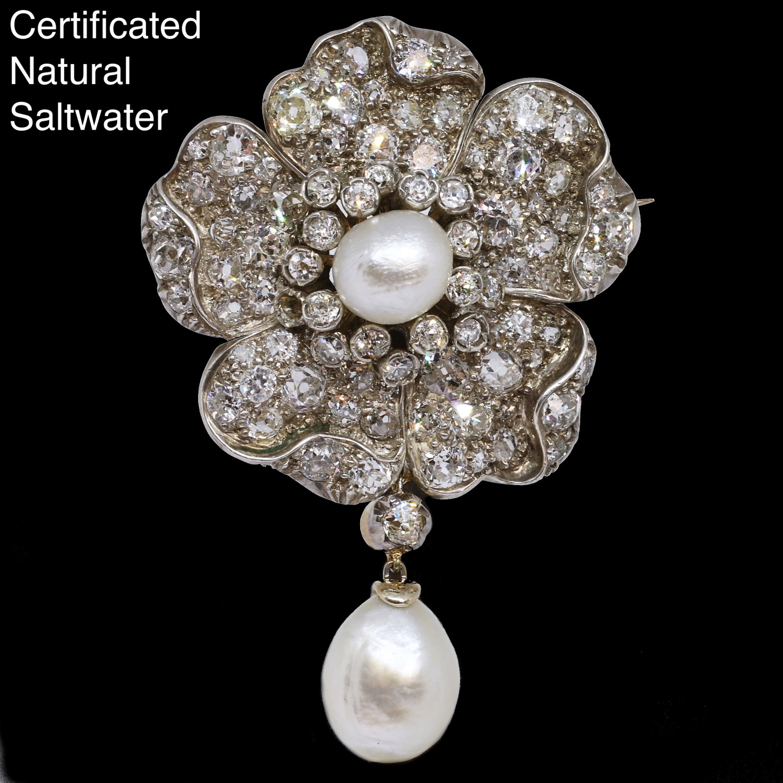 ANTIQUE CERTIFICATED NATURAL SALTWATER PEARL AND DIAMOND FLORAL BROOCH: ANTIQUE CERTIFICATED NATURAL SALTWATER PEARL AND DIAMOND FLORAL BROOCH,15 grams.Set with 2 large natural saltwater pearls, largest of approx. 11.5 mm. Respectively 4.91 and 4.86 ct. (Certificated,