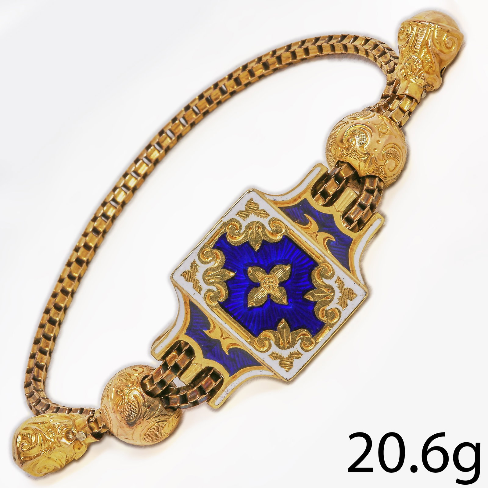 VICTORIAN MULTI-COLOR SLIDER BRACELET: VICTORIAN MULTI-COLOR SLIDER BRACELET,29.6 grams, testing high carat gold.The central section with blue and white enamel.The sliders and ends with fine relief and engraved decoration.
