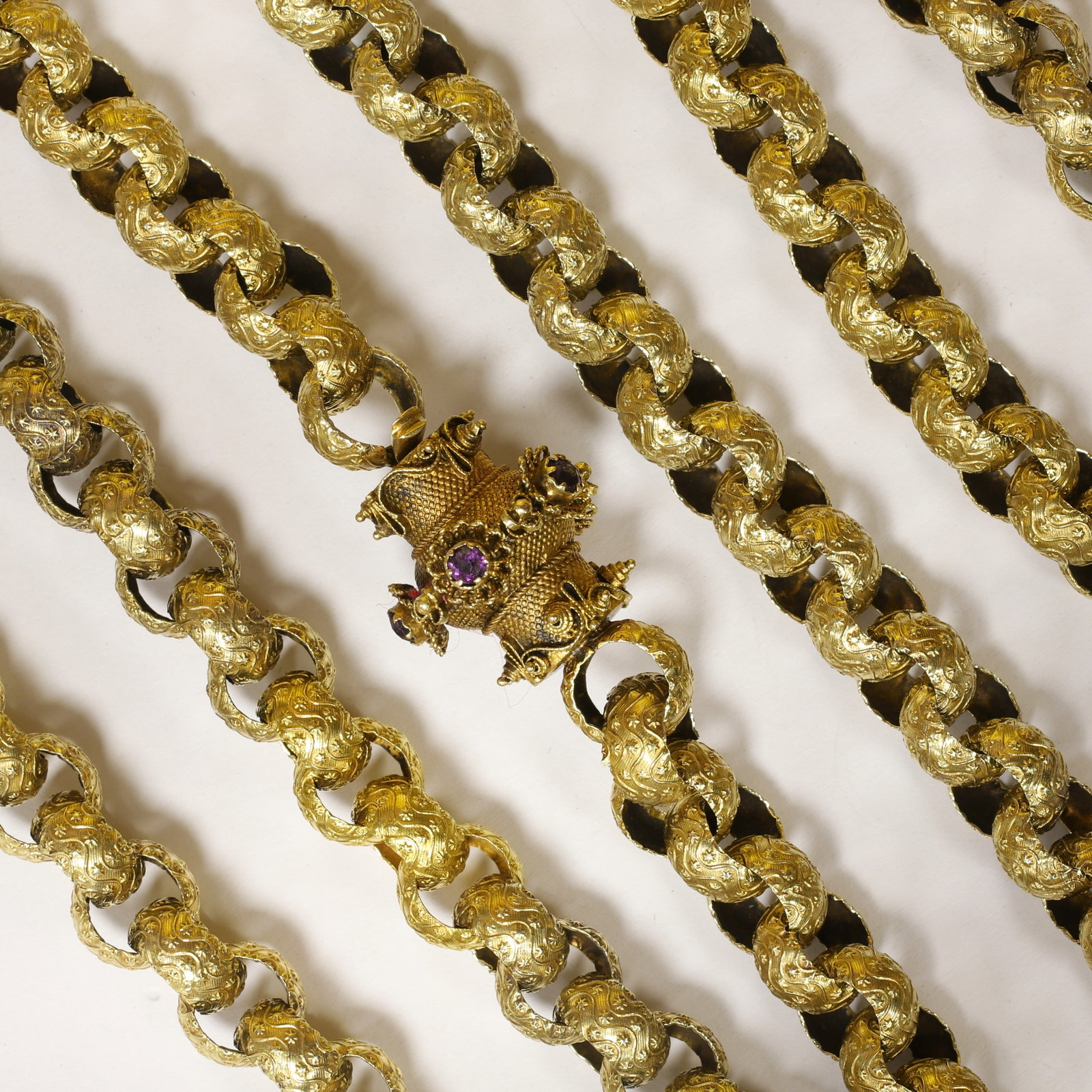 FANTASTIC LARGE GEORGIAN BELCHER LINK GUARD CHAIN NECKLACE: FANTASTIC LARGE GEORGIAN BELCHER LINK GUARD CHAIN NECKLACE,74,3 grams, testing high carat gold.Each link individually decorated with relief stars.Links of approx. 9 mm.Fantastic clasp set with amethys