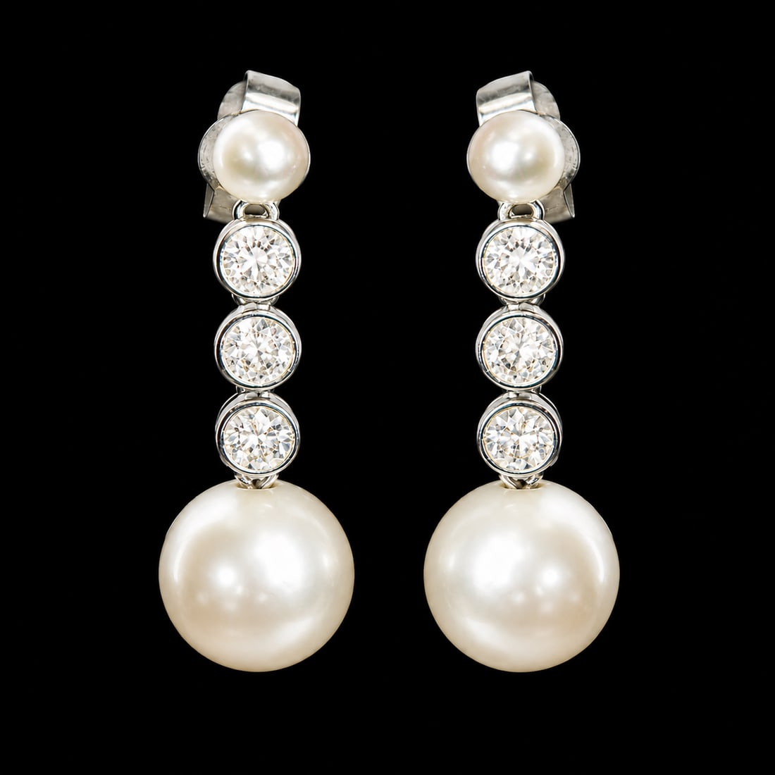 PAIR OF CERTIFICATED NATURAL SALTWATER PEARL AND DIAMOND EARRINGS: PAIR OF CERTIFICATED NATURAL SALTWATER PEARL AND DIAMOND EARRINGS,3.2 grams, testing 18 ct. gold.Largest pearl of approx. 7.8 mm. (Certificated, Natural, Saltwater).L. 2.4 cm.See certificate.