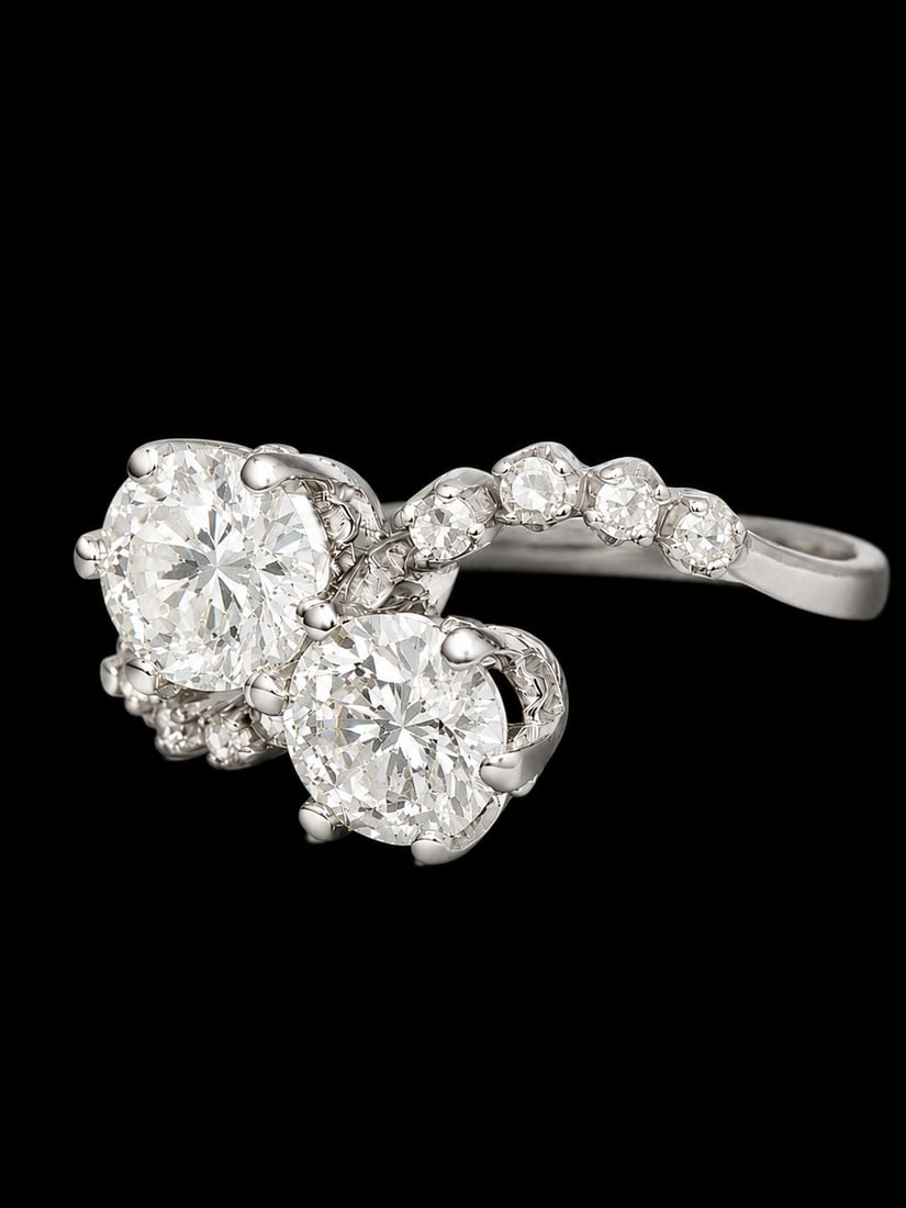 DIAMOND TOI-ET-MOI RING: DIAMOND TOI-ET-MOI RING,3 grams, testing 18 ct. gold.Bright and lively diamonds, totalling approx. 1.20 ct.Size L.