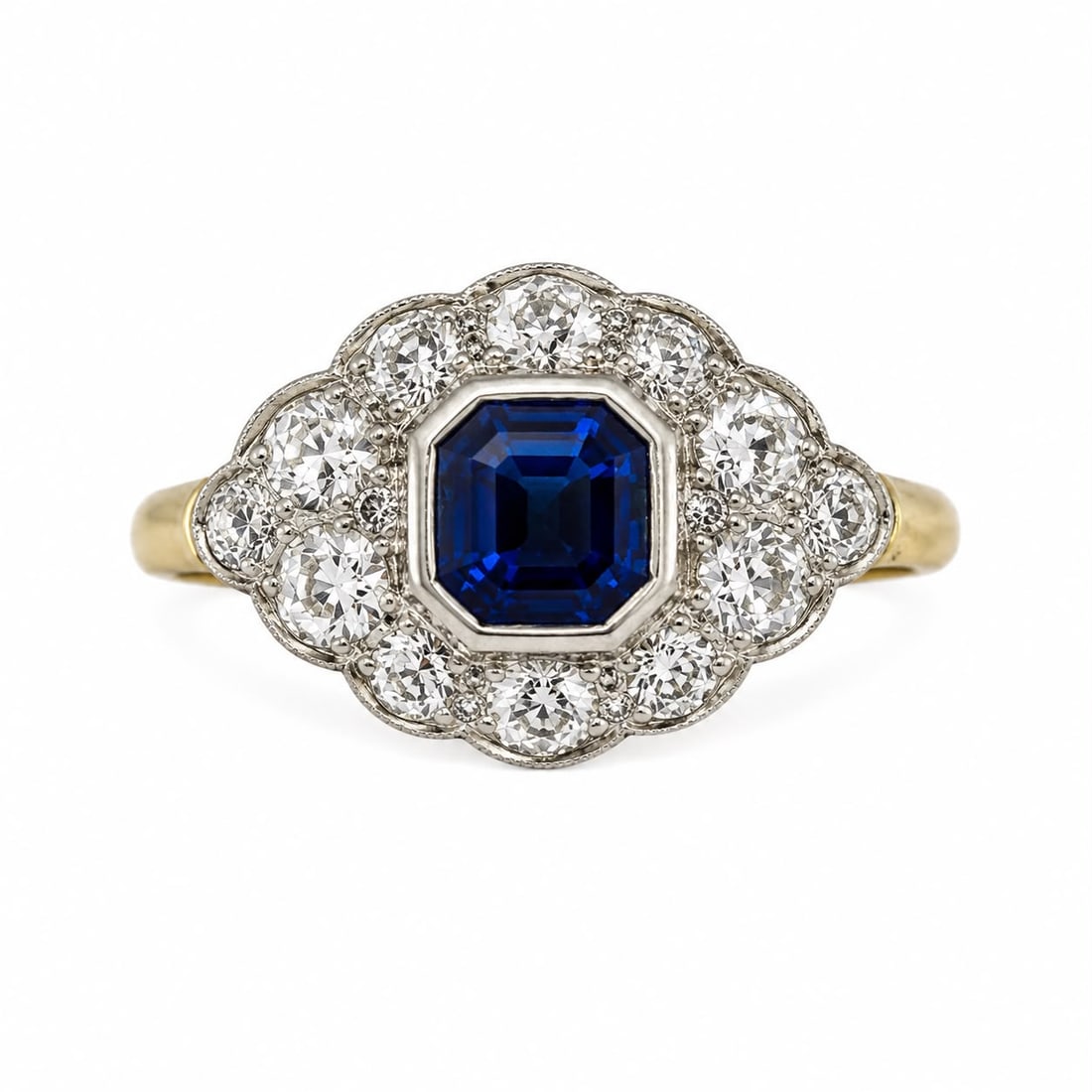 SAPPHIRE AND DIAMOND CLUSTER RING: SAPPHIRE AND DIAMOND CLUSTER RING,4 grams, testing 18 ct. gold.Rich and vibrant sapphire of approx. 1.56 ct.Diamonds bright and lively, totalling approx. 1.20 ct.Size P 1/2.
