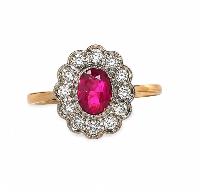 RUBY AND DIAMOND CLUSTER RING: RUBY AND DIAMOND CLUSTER RING,18 ct. gold.Rich and vibrant ruby.Diamonds bright and lively.Size N 1/2.