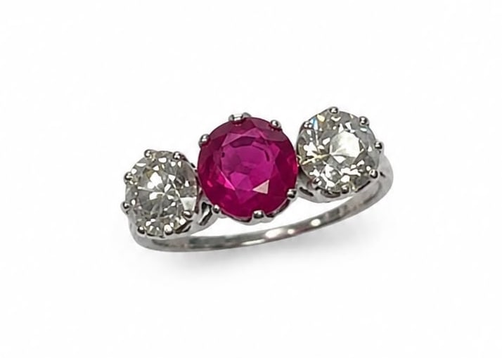 CERTIFICATED BURMA NO HEAT RUBY AND DIAMOND 3-STONE RING: CERTIFICATED BURMA NO HEAT RUBY AND DIAMOND 3-STONE RING,3,2 grams, testing platinum.Rich and vibrant ruby of approx. 1.84 ct. (Certificated, Burma, 'Mogok', No Heat).Diamonds bright and lively,