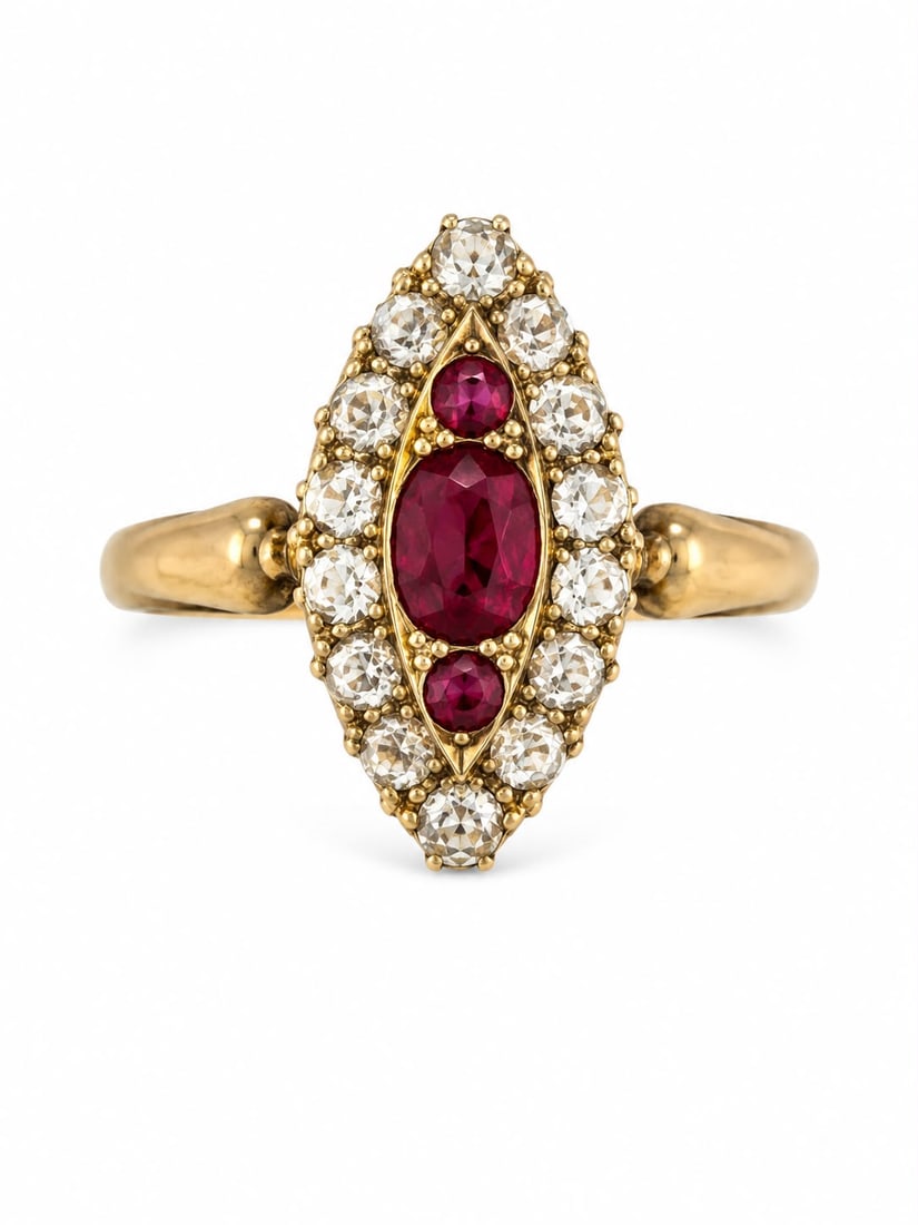 RUBY AND DIAMOND MARQUISE SHAPED RING: RUBY AND DIAMOND MARQUISE SHAPED RING,3,3 grams, 18 ct. gold.Rich and vibrant rubies.Diamonds bright and lively.L. head 1.5 cm.Size P 1/2.