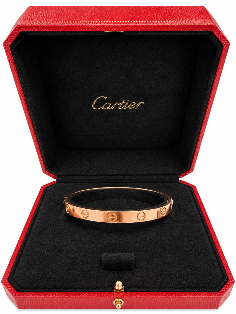 CARTIER LOVE BANGLE: CARTIER LOVE BANGLE 31.5 grams Cartier - A 'LOVE' bangle in 18ct yellow gold, signed Cartier 750, bearing Swiss St Bernards dogs head, size 18, inner bangle diameter approximately 6.0cm, width