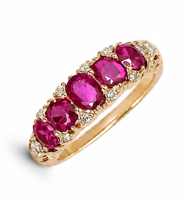 RUBY AND DIAMOND 5-STONE RING: RUBY AND DIAMOND 5-STONE RING,4,9 grams, testing 18 ct. gold.Rich and vibrant rubies, totalling approx. 1.20 ct.Diamonds bright and lively.Size L 1/2.