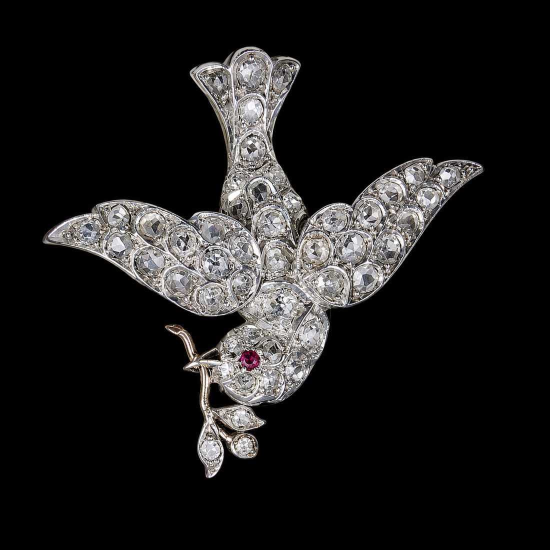 ANTIQUE DIAMOND DOVE BROOCH: ANTIQUE DIAMOND DOVE BROOCH 8.5 grams lively diamonds, ruby eye in great condition L 3.5 cm W 4 cm