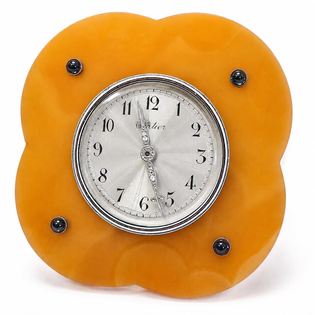 A RARE ART DECO AGATE, SAPPHIRE AND DIAMOND CARTIER STRUT CLOCK: A RARE ART DECO AGATE, SAPPHIRE AND DIAMOND CARTIER STRUT CLOCK the agate case with four circular cabochon sapphires and gilt white enamel banded bezel enclosing a silver guilloche dial with Arabic nu