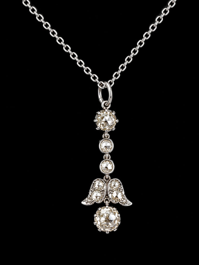 DIAMOND PENDANT NECKLACE: DIAMOND PENDANT NECKLACE,3.4 grams, testing 18 ct. gold.Lovely articulated.Diamonds bright and lively, totalling approx. 1.50 ct.L. pendant 3.2 cm.
