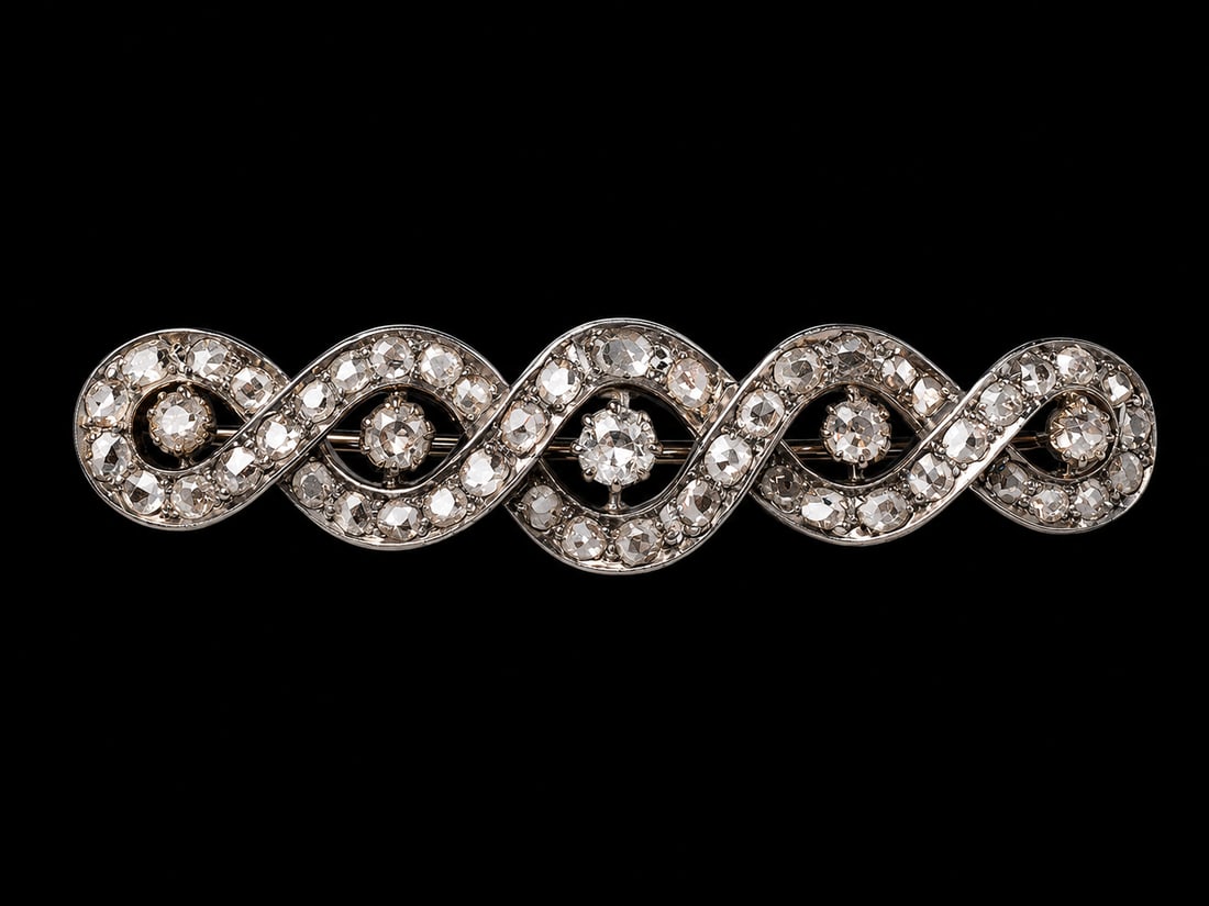 VICTORIAN DIAMOND ENTWINED BROOCH: VICTORIAN DIAMOND ENTWINED BROOCH,9.6 grams, testing high carat gold and silver.Bright and lively old cut diamonds.W. 5 cm.