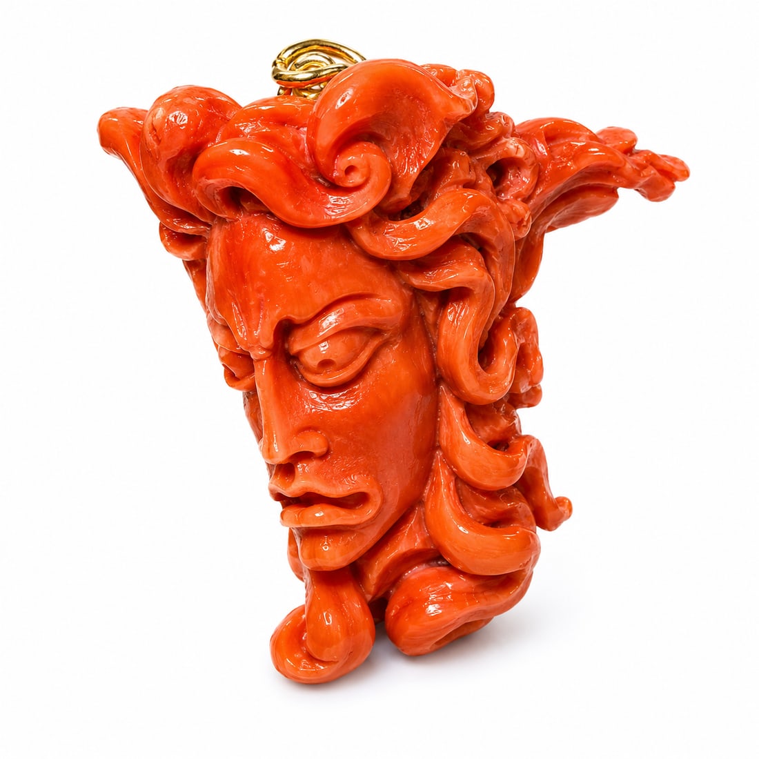 FANTASTIC LARGE CARVED CORAL 'MEDUSA' PENDANT: FANTASTIC LARGE CARVED CORAL 'MEDUSA' PENDANT,60,5 grams,.Fantastic detailed carved head of Medussa, with detailed snakes as hair.5.7 x 5.1 x 3.2 cm..