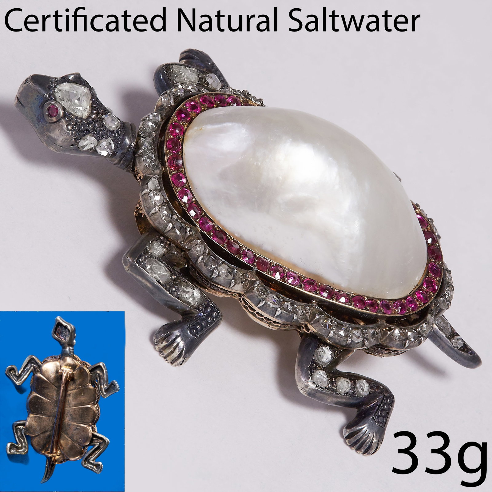 MAGNIFICENT ANTIQUE CERTIFICATED PEARL DIAMOND AND RUBY TURTLE BROOCH: MAGNIFICENT ANTIQUE CERTIFICATED PEARL DIAMOND AND RUBY TURTLE BROOCH,33 grams.The body of a large pearl of approx. 29.9 x 10.9 x 11.5 mm. (certificated).The head, legs, feet and tail