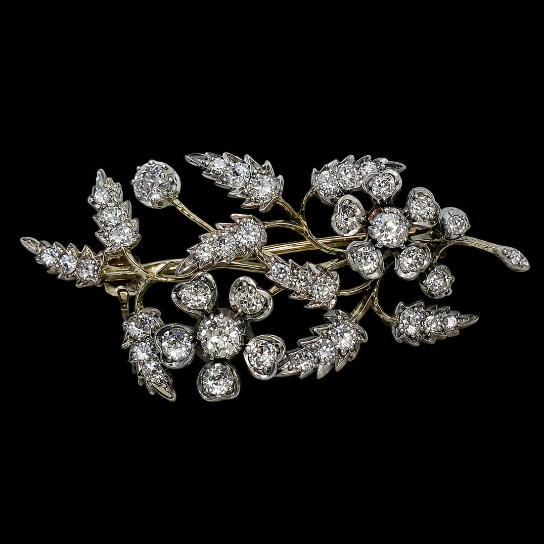 VICTORIAN DIAMOND SPRAY BROOCH: VICTORIAN DIAMOND SPRAY BROOCH,7.9 grams, testing high carat gold and silver.Diamonds bright and lively, totalling approx. 2.20 ct.L. 5.1 cm.