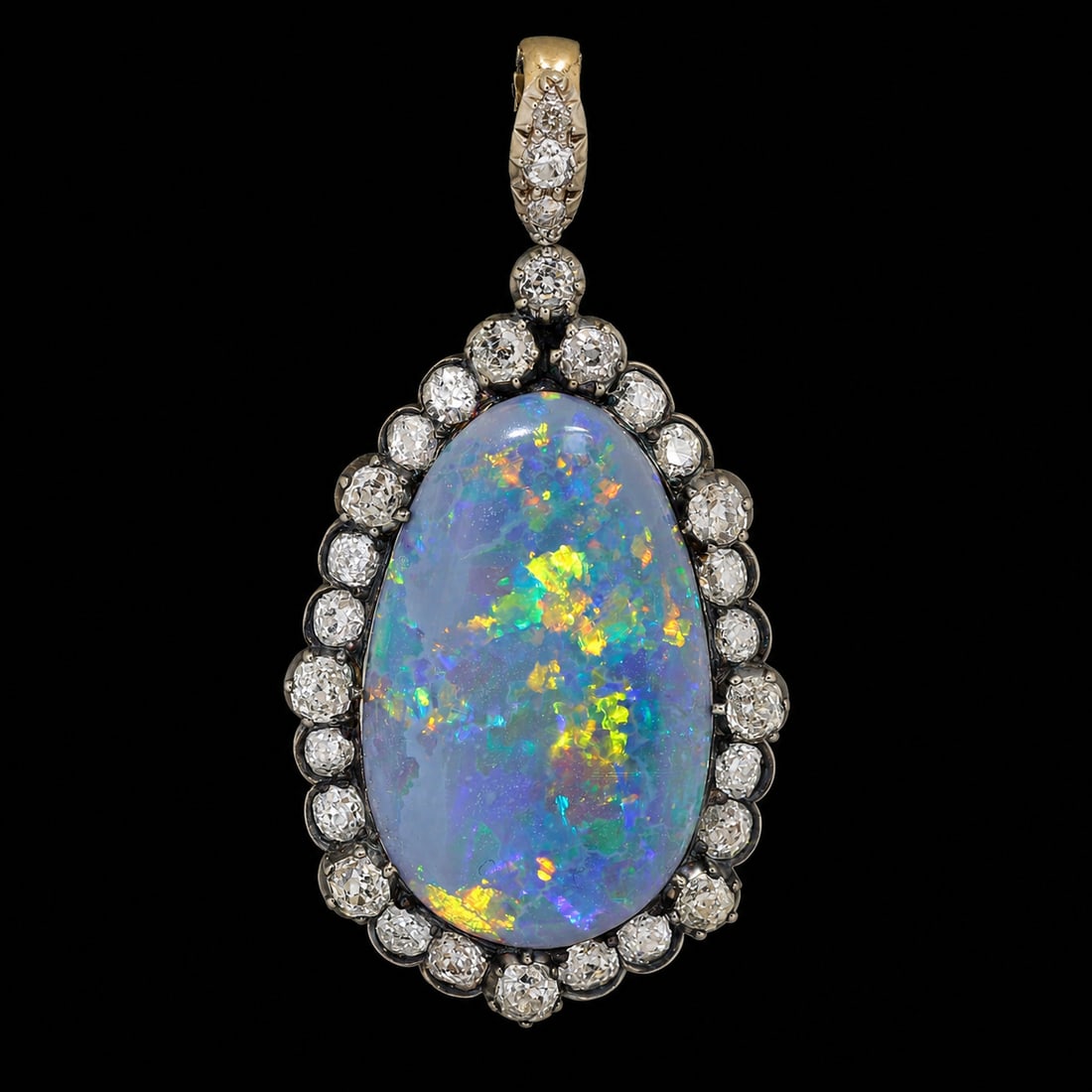 FANTASTIC ANTIQUE BLACK OPAL AND DIAMOND PENDANT: FANTASTIC ANTIQUE BLACK OPAL AND DIAMOND PENDANT,8,5 grams, testing high carat gold and silver.Fantastic large black opal of approx. 16 ct. with great play of colour.Bright and lively old cut diamonds