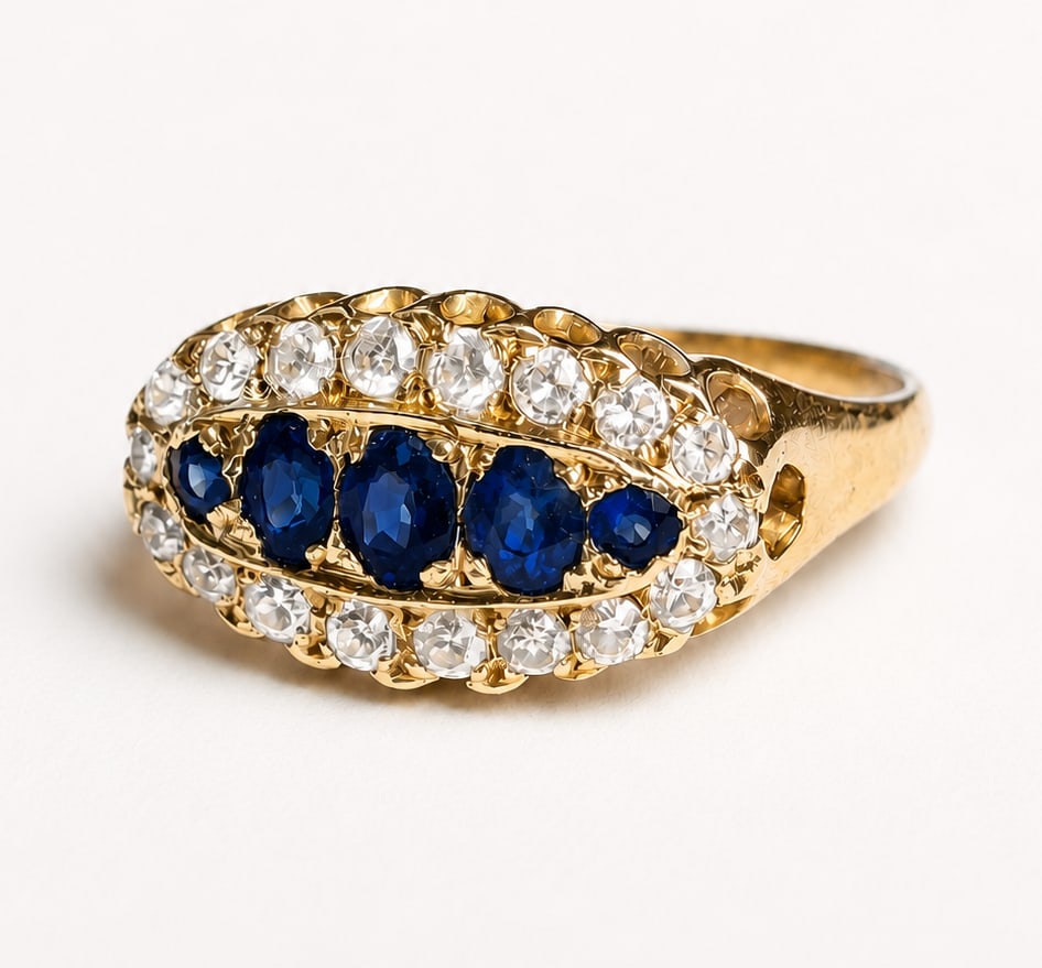 SAPPHIRE AND DIAMOND RING: SAPPHIRE AND DIAMOND RING,18 ct. gold.Rich and vibrant sapphires.Diamonds bright and lively.Size M.